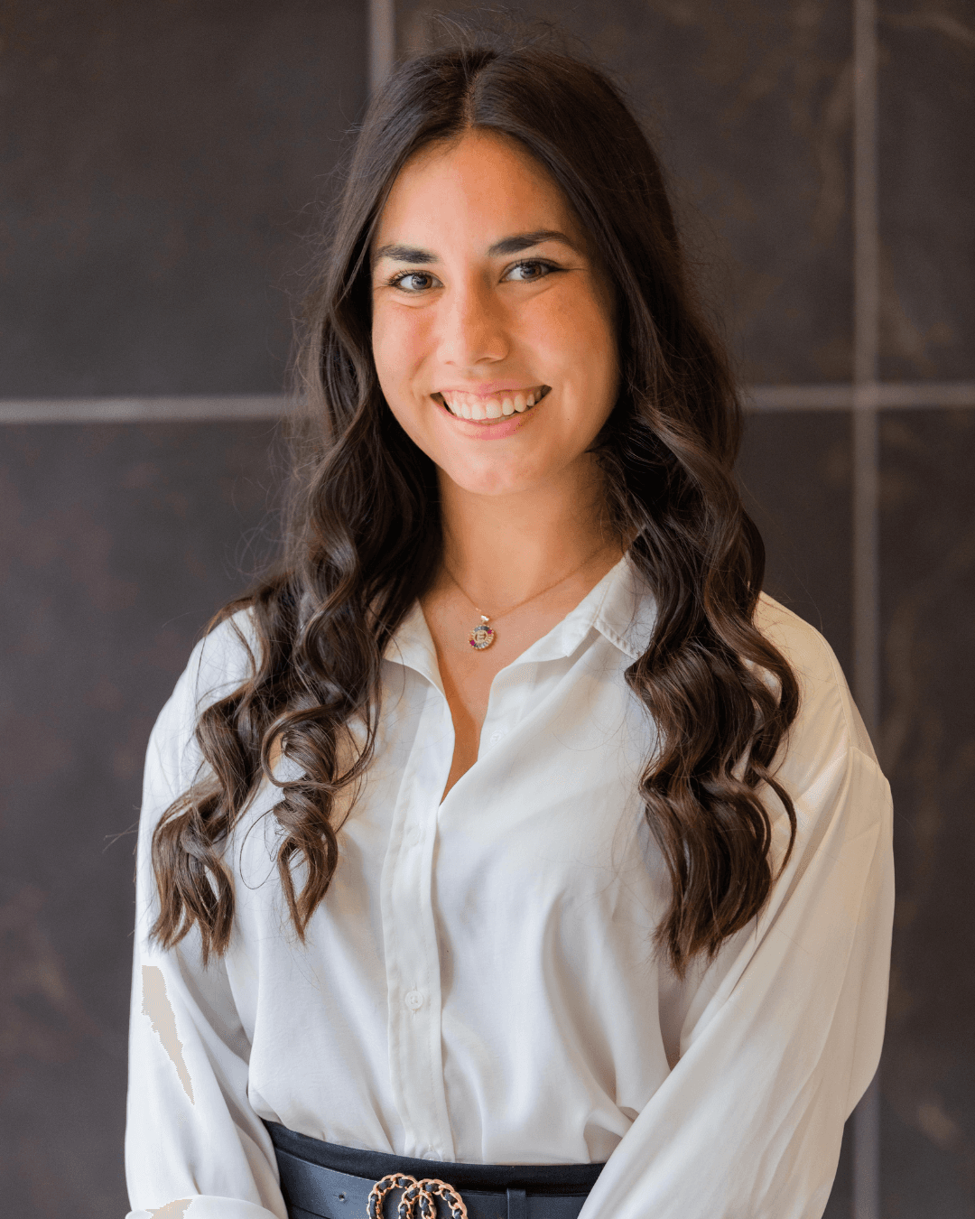 Erica Rempel smiling in a white blouse
